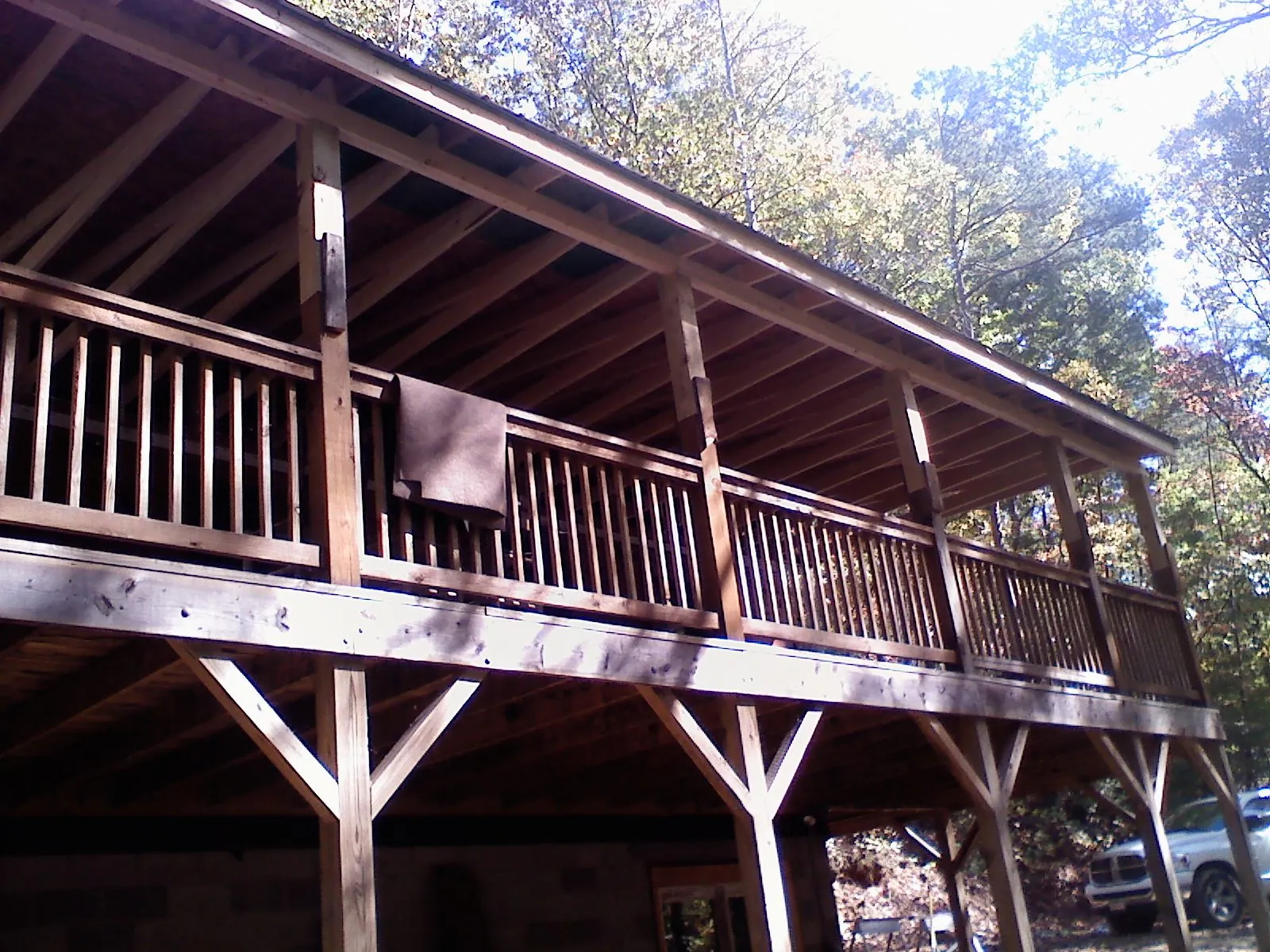Timber framing under a new elevated porch and deck — Roof Leak Repair in Beach City by Roofing Brothers
